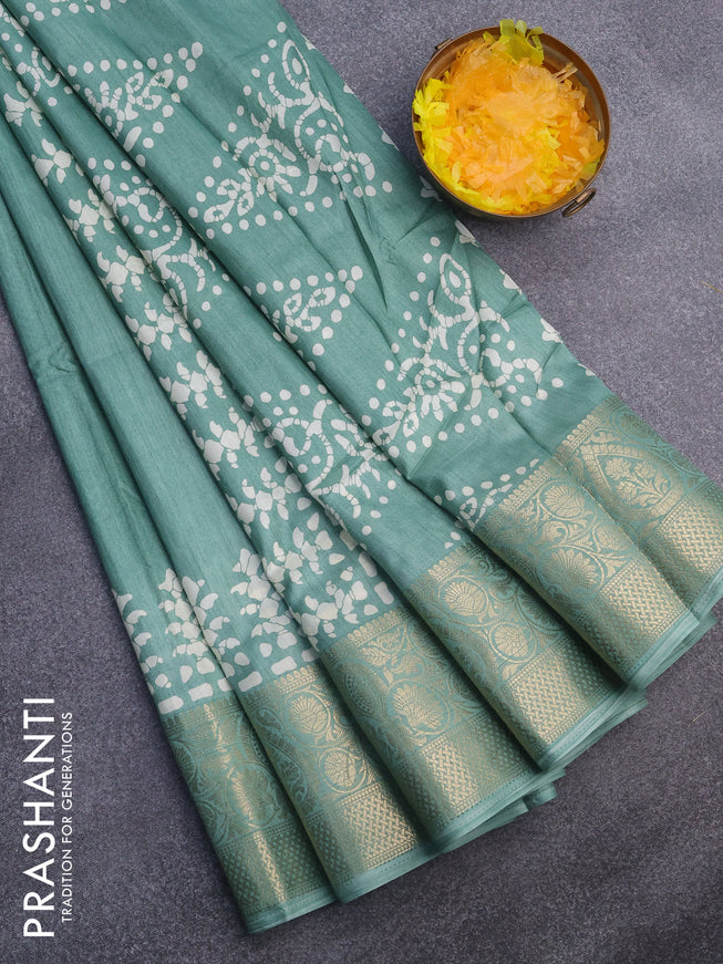 Semi dola saree pastel green with butta prints and zari woven border