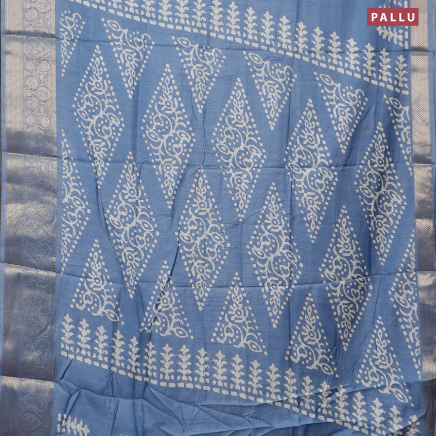 Semi dola saree blue shade with butta prints and zari woven border