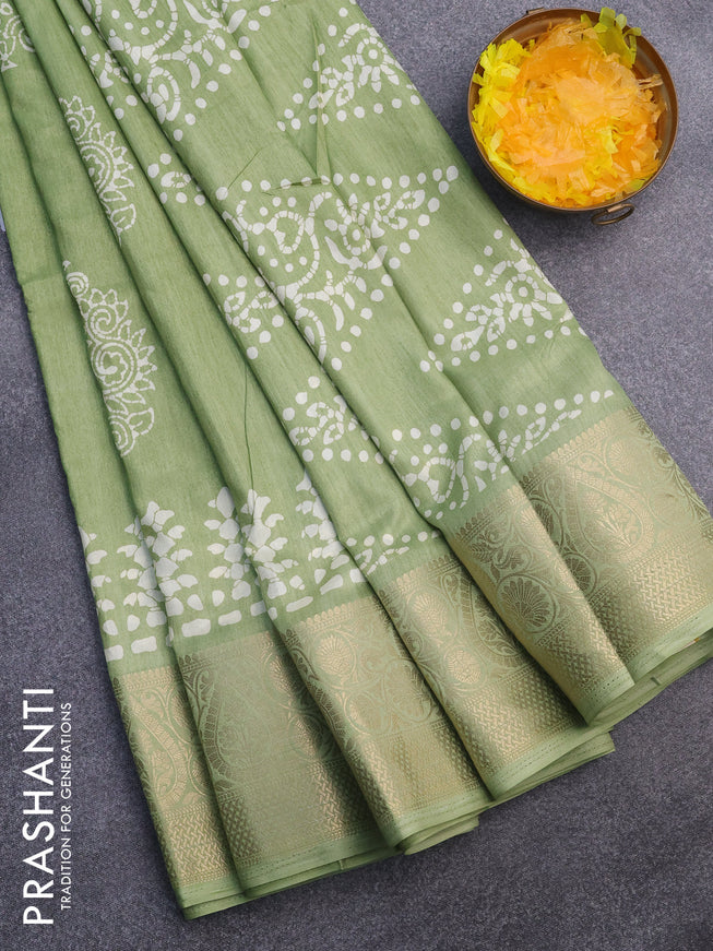 Semi dola saree green shade with butta prints and zari woven border