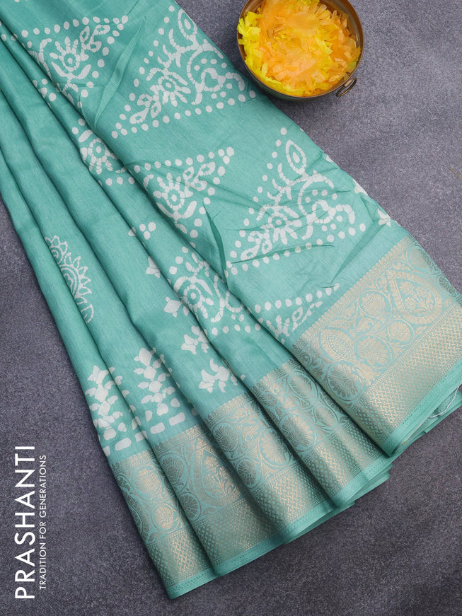 Semi dola saree teal blue shade with butta prints and zari woven border