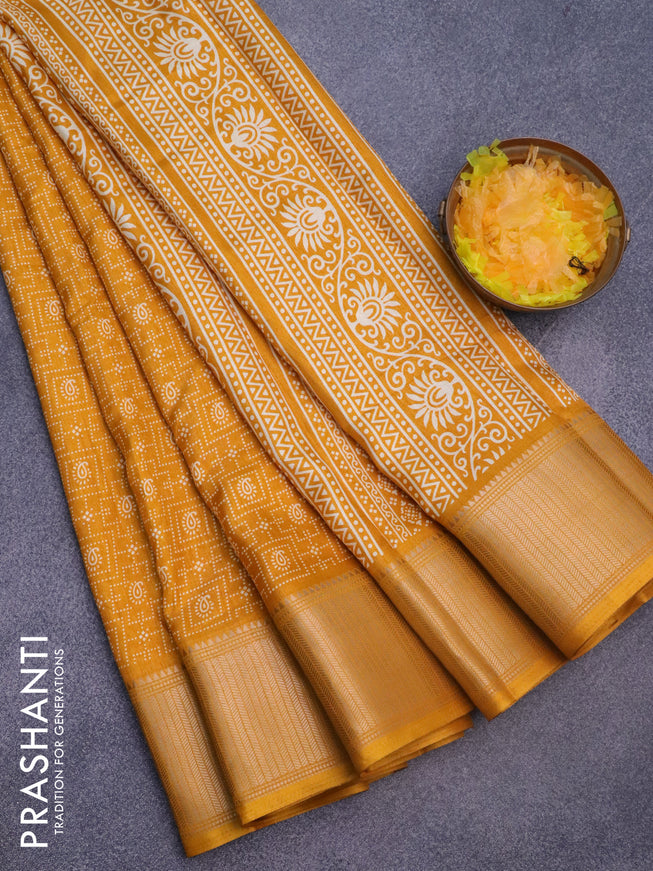 Semi dola saree mustard yellow with allover prints and zari woven border