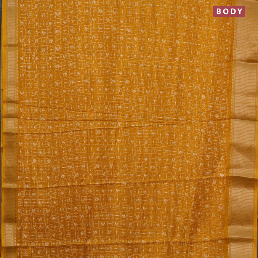 Semi dola saree mustard yellow with allover prints and zari woven border