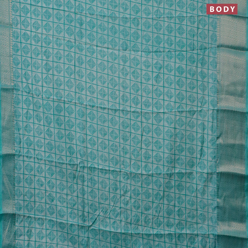 Semi dola saree teal blue with allover geometric prints and zari woven border