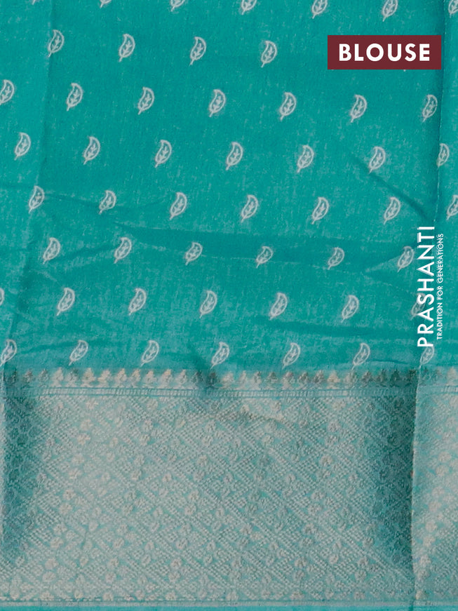 Semi dola saree teal blue with allover geometric prints and zari woven border