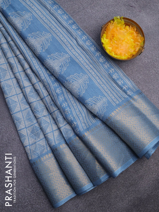 Semi dola saree blue shade with allover geometric prints and zari woven border