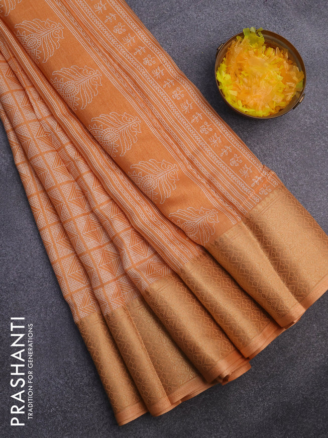 Semi dola saree peach orange with allover geometric prints and zari woven border