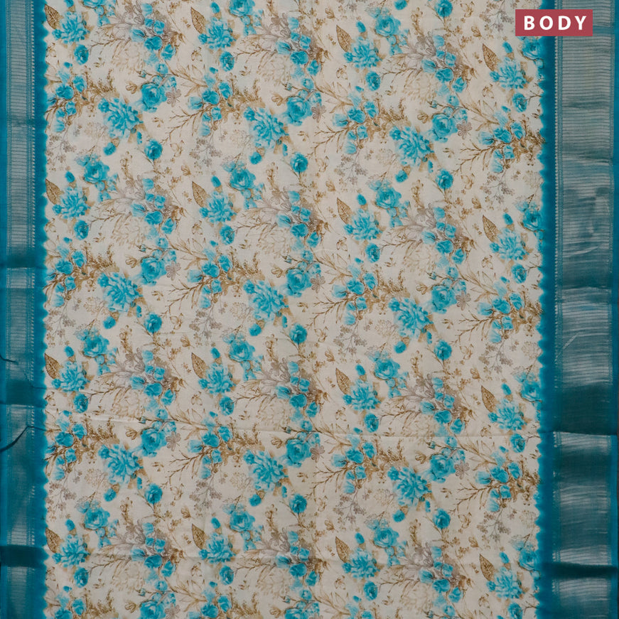 Semi dola saree cream and teal blue with allover floral prints and zari woven border