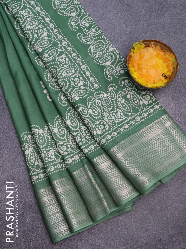 Semi dola saree green with batik butta prints and zari woven border