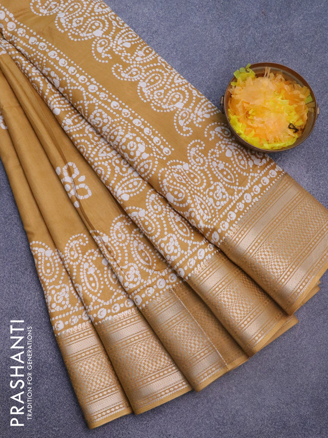 Semi dola saree mustard yellow with batik butta prints and zari woven border