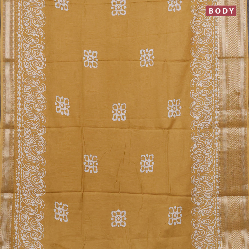 Semi dola saree mustard yellow with batik butta prints and zari woven border