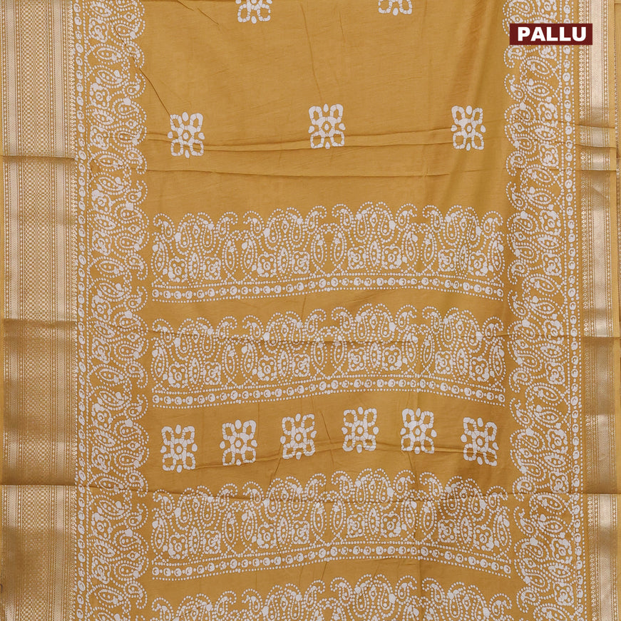 Semi dola saree mustard yellow with batik butta prints and zari woven border