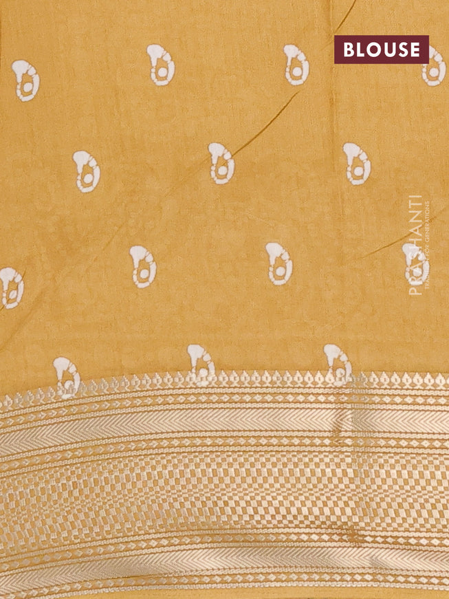 Semi dola saree mustard yellow with batik butta prints and zari woven border