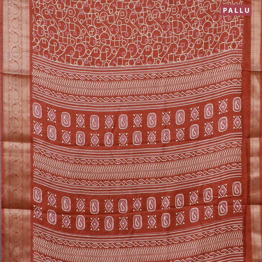 Semi dola saree rust shade with allover geometric prints and zari woven border