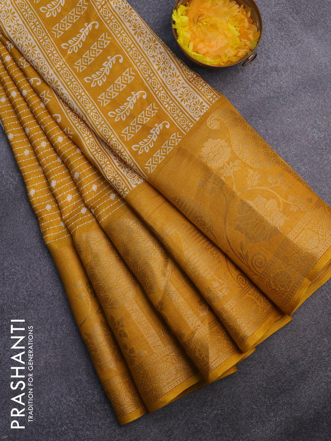 Semi dola saree mustard yellow with allover prints and long rich zari woven border