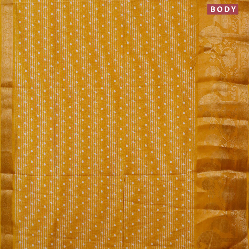 Semi dola saree mustard yellow with allover prints and long rich zari woven border