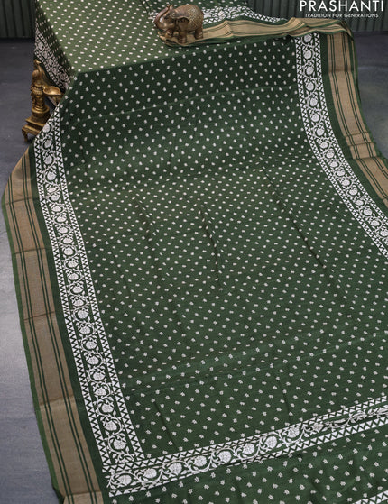 Semi matka tussar saree sap green with allover floral butta prints and zari woven border