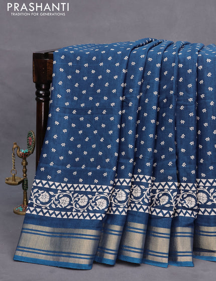 Semi matka tussar saree peacock blue with allover floral butta prints and zari woven border