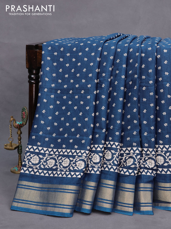 Semi matka tussar saree peacock blue with allover floral butta prints and zari woven border