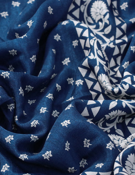 Semi matka tussar saree peacock blue with allover floral butta prints and zari woven border