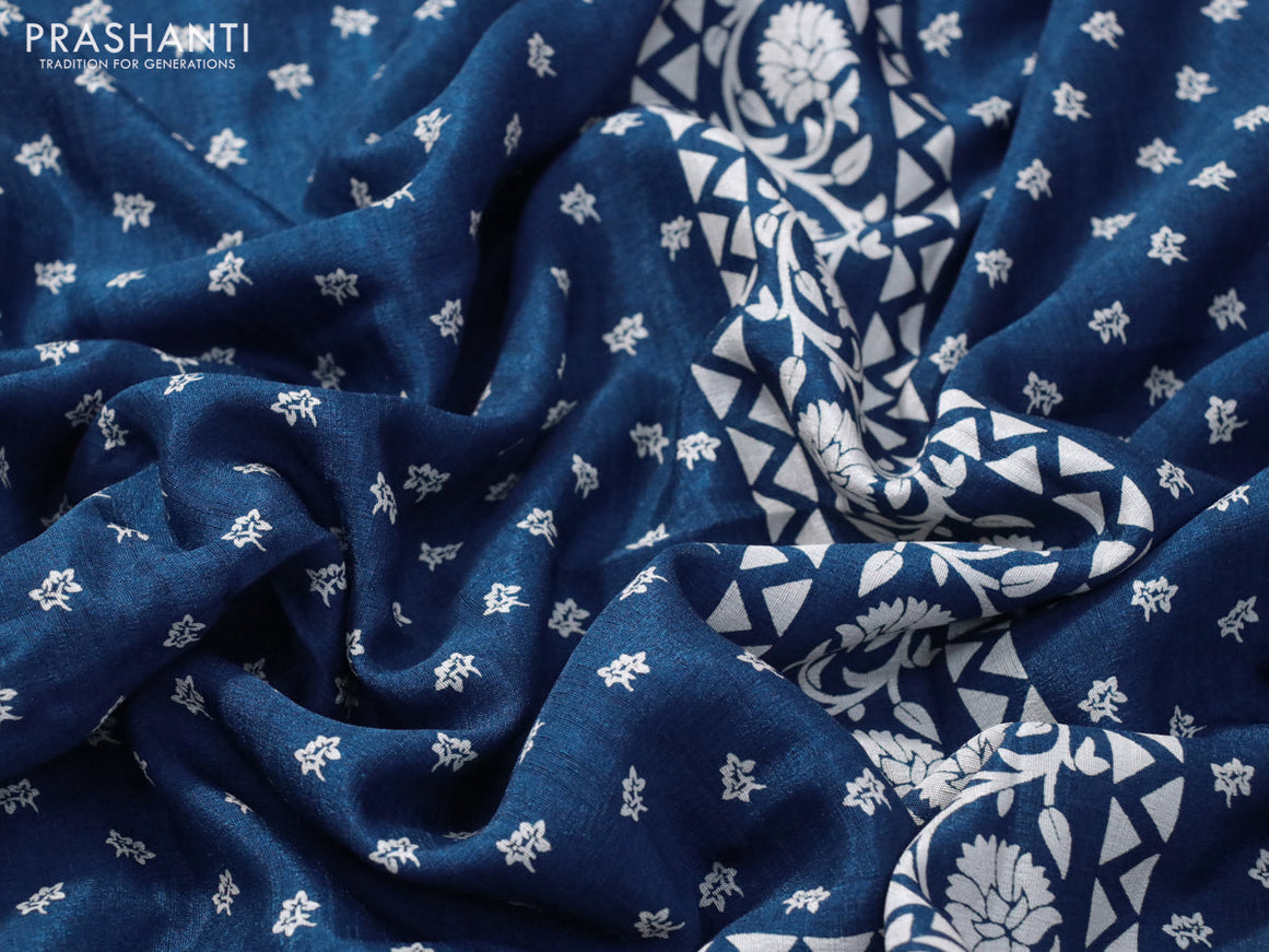 Semi matka tussar saree peacock blue with allover floral butta prints and zari woven border