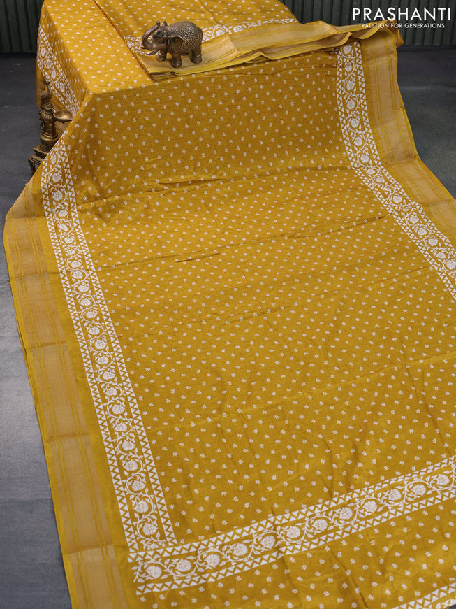 Semi matka tussar saree dark mustard shade with allover floral butta prints and zari woven border