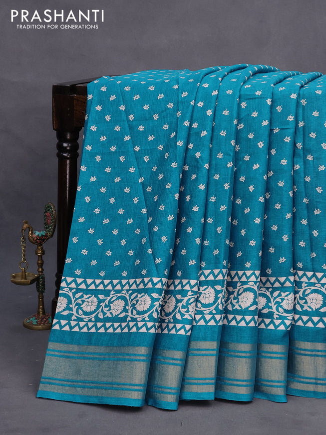 Semi matka tussar saree teal blue with allover floral butta prints and zari woven border