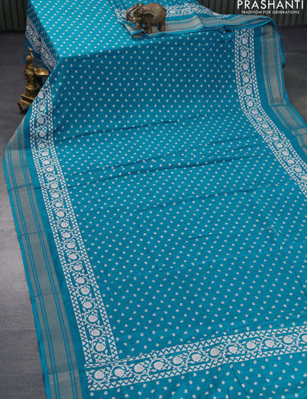 Semi matka tussar saree teal blue with allover floral butta prints and zari woven border