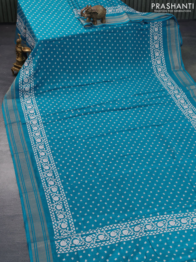 Semi matka tussar saree teal blue with allover floral butta prints and zari woven border