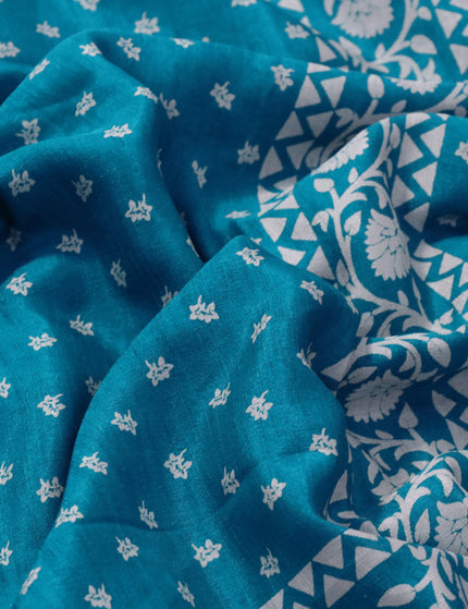 Semi matka tussar saree teal blue with allover floral butta prints and zari woven border