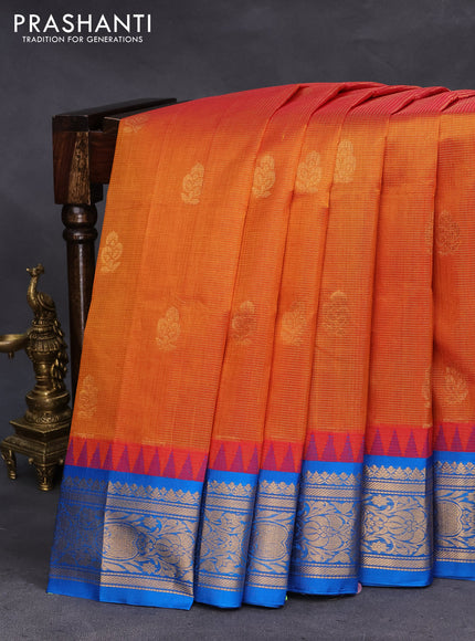 Kuppadam silk cotton saree dual shade of mustard and cs blue with allover zari weaves & buttas and temple design zari woven border