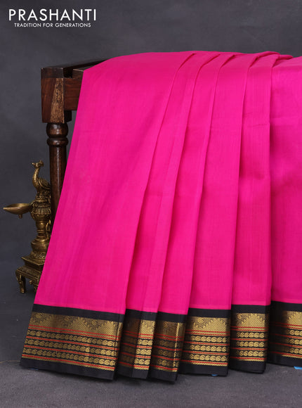 Silk cotton saree pink and black with plain body and zari woven korvai border