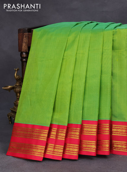 Silk cotton saree light green and red with plain body and zari woven korvai border