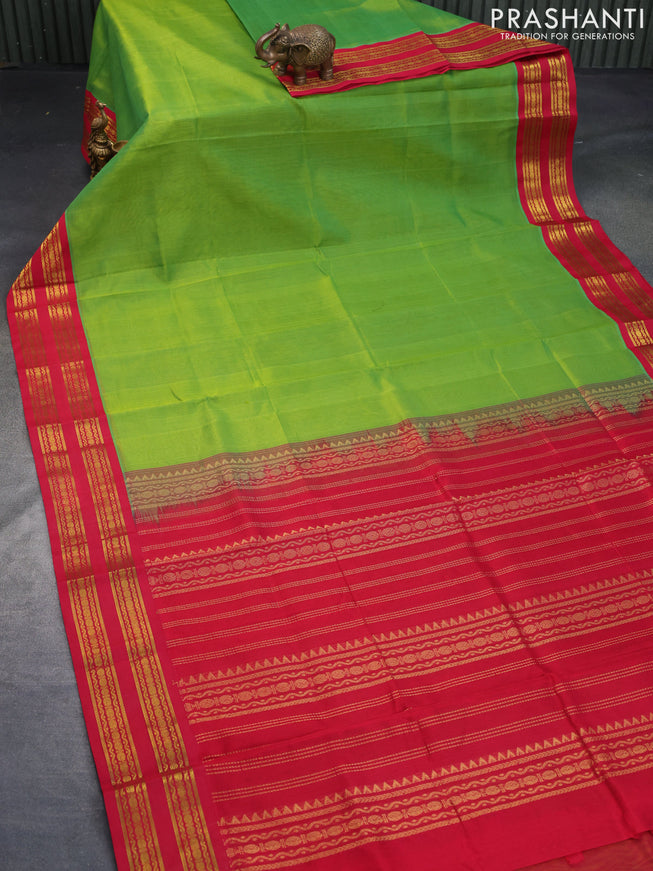 Silk cotton saree light green and red with plain body and zari woven korvai border