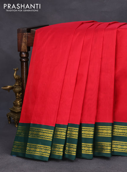 Silk cotton saree red and dark green with plain body and zari woven korvai border