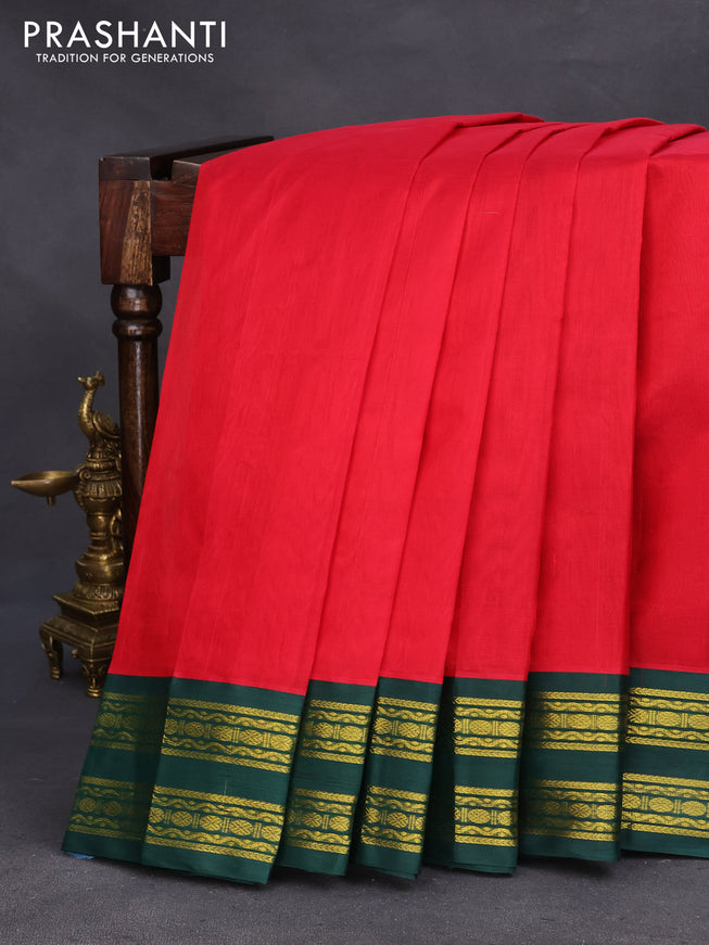 Silk cotton saree red and dark green with plain body and zari woven korvai border