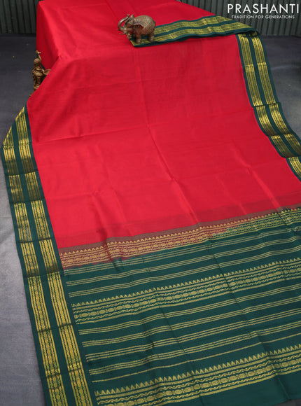 Silk cotton saree red and dark green with plain body and zari woven korvai border