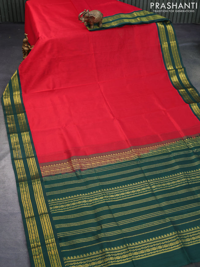 Silk cotton saree red and dark green with plain body and zari woven korvai border