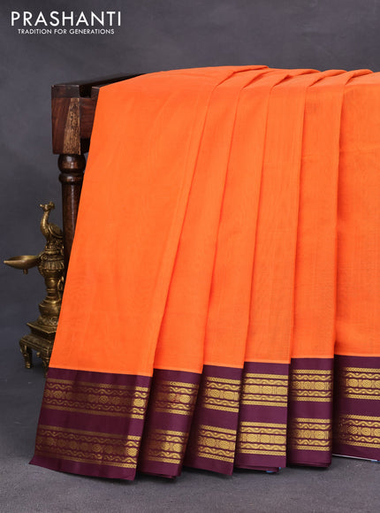 Silk cotton saree orange and wine shade with plain body and zari woven korvai border