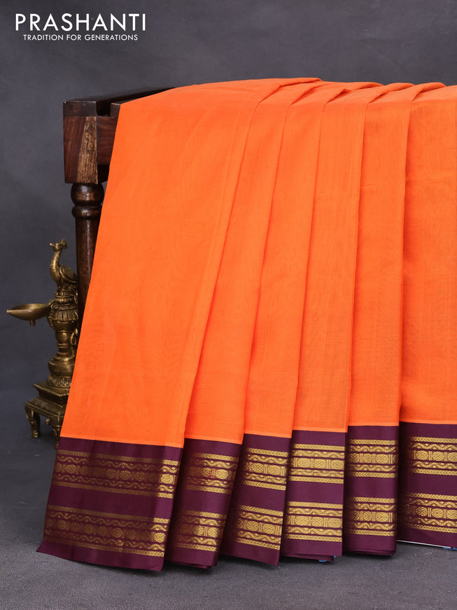 Silk cotton saree orange and wine shade with plain body and zari woven korvai border