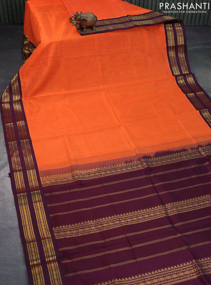 Silk cotton saree orange and wine shade with plain body and zari woven korvai border