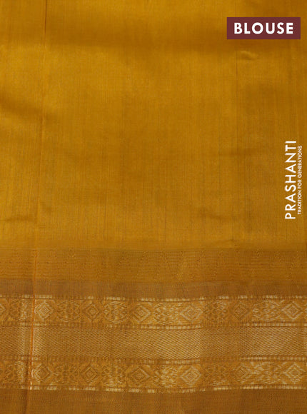 Silk cotton saree light blue and mustard shade with zari woven buttas and temple design zari woven korvai border