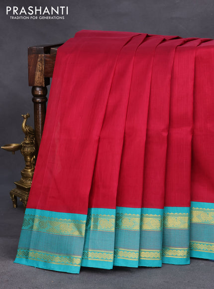 Silk cotton saree maroon and teal blue with plain body and zari woven korvai border