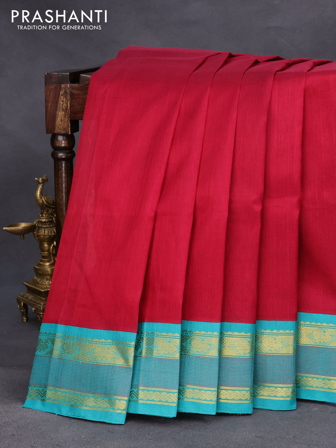 Silk cotton saree maroon and teal blue with plain body and zari woven korvai border