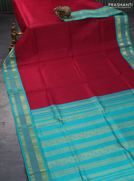 Silk cotton saree maroon and teal blue with plain body and zari woven korvai border