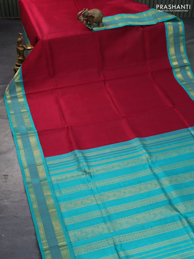 Silk cotton saree maroon and teal blue with plain body and zari woven korvai border