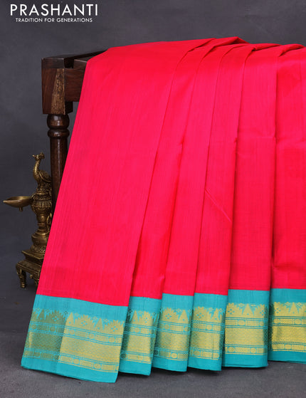 Silk cotton saree pink and teal blue with plain body and zari woven korvai border