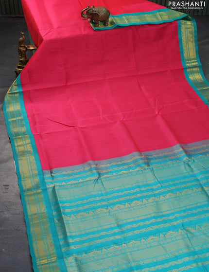 Silk cotton saree pink and teal blue with plain body and zari woven korvai border