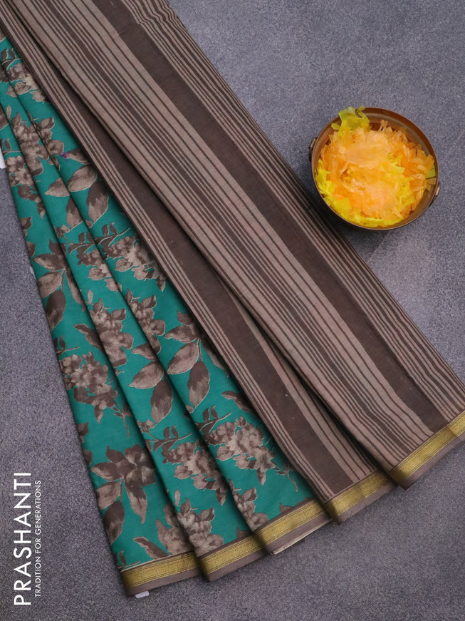 Muslin cotton saree teal green and grey with allover prints and small zari woven border