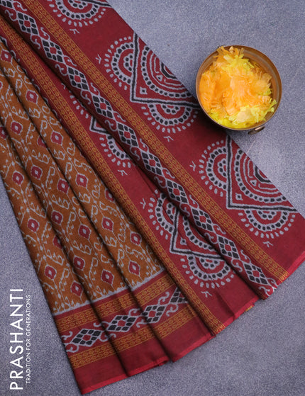 Muslin cotton saree dark mustard and maroon with allover ikat weaves and printed border