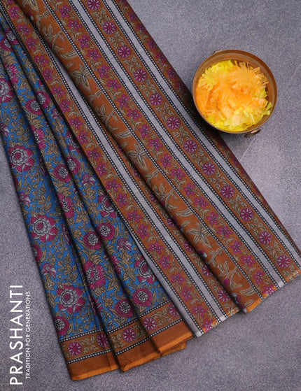 Muslin cotton saree cs blue and mustard shade with allover floral prints and printed border